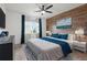 Cozy bedroom featuring a wood accent wall and a relaxing decor with natural light at 960 Starkey Rd # 3406, Largo, FL 33771