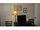 Bedroom featuring a dresser, TV, decorative lamp, and wall art adding a personal touch at 9911 Dahlia N St # 38, Pinellas Park, FL 33782