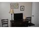 Functional bedroom with a dresser, TV, decorative lamp, and wall art adding a personal touch at 9911 Dahlia N St # 38, Pinellas Park, FL 33782