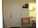 Cozy entryway featuring a comfortable chair with a decorative coral pillow at 9911 Dahlia N St # 38, Pinellas Park, FL 33782