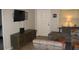 Welcoming living room featuring a sectional sofa and modern television at 9911 Dahlia N St # 38, Pinellas Park, FL 33782