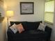 Comfortable living room with a navy sofa and coastal-themed decor at 9911 Dahlia N St # 38, Pinellas Park, FL 33782