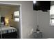 Cozy main bedroom featuring TV, nightstand and ensuite bathroom at 9911 Dahlia N St # 38, Pinellas Park, FL 33782
