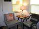 Cozy sitting area with chairs, a table, and a decorative pillow at 9911 Dahlia N St # 38, Pinellas Park, FL 33782