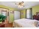 Spacious bedroom with hardwood floors and a window letting in natural light at 101 Sharewood Dr, Valrico, FL 33594