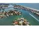 Stunning aerial view of the waterfront property, showcasing its prime location and architectural design at 10100 Tarpon Dr, Treasure Island, FL 33706