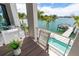 Enjoy waterfront views from this cozy balcony, ideal for morning coffee or evening relaxation at 10100 Tarpon Dr, Treasure Island, FL 33706