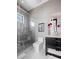 Sleek bathroom featuring a glass-enclosed shower, vanity with modern fixtures, and a toilet at 10100 Tarpon Dr, Treasure Island, FL 33706
