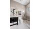 Well-appointed bathroom featuring a glass shower, modern vanity, and neutral tile at 10100 Tarpon Dr, Treasure Island, FL 33706