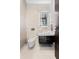 Modern powder room with patterned tile and sleek, integrated sink and vanity at 10100 Tarpon Dr, Treasure Island, FL 33706
