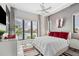 Bedroom with great light, large windows with water view, and uniquely textured wall at 10100 Tarpon Dr, Treasure Island, FL 33706