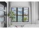 Bright bedroom featuring a scenic view of the water, highlighted by a decorative plant at 10100 Tarpon Dr, Treasure Island, FL 33706