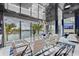 The dining room features a wall of windows overlooking the water at 10100 Tarpon Dr, Treasure Island, FL 33706