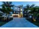 Contemporary home with a modern design, striking entrance, and professional landscaping at 10100 Tarpon Dr, Treasure Island, FL 33706