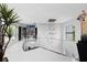Open hallway with modern lighting, neutral walls, and a glimpse of the living spaces at 10100 Tarpon Dr, Treasure Island, FL 33706