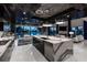 A gourmet kitchen features a waterfall countertop, and an open layout to other living spaces at 10100 Tarpon Dr, Treasure Island, FL 33706