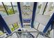 Soaring ceilings and a waterfront view in this open and bright modern living room at 10100 Tarpon Dr, Treasure Island, FL 33706