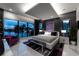 Modern primary bedroom with stunning waterfront views, a plush king bed, and elegant decor at 10100 Tarpon Dr, Treasure Island, FL 33706
