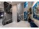 Modern staircase with metal railings, open design, and lots of natural light at 10100 Tarpon Dr, Treasure Island, FL 33706