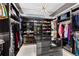 Expansive walk-in closet with custom shelving and ample storage for clothing and accessories at 10100 Tarpon Dr, Treasure Island, FL 33706