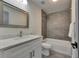 Well lit bathroom features white vanity with marble countertop and modern shower with grey tiling at 1025 Apollo Beach Blvd # 1, Apollo Beach, FL 33572