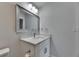 Bathroom featuring a vanity with shaker cabinets, white countertop, and framed mirror at 1025 Apollo Beach Blvd # 1, Apollo Beach, FL 33572