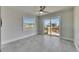 Bedroom with sliding glass doors leading to a deck showcasing a beautiful canal view and natural light at 1025 Apollo Beach Blvd # 1, Apollo Beach, FL 33572