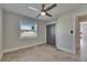 Bedroom showcasing a ceiling fan, window with blinds, and closet space creating a functional living area at 1025 Apollo Beach Blvd # 1, Apollo Beach, FL 33572