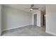 This bedroom features a ceiling fan and an access door, with tiled floor at 1025 Apollo Beach Blvd # 1, Apollo Beach, FL 33572