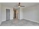 This bedroom features a ceiling fan and an access door, with large tile floor at 1025 Apollo Beach Blvd # 1, Apollo Beach, FL 33572