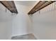Empty closet space features wire shelves, white walls, and tiled floor at 1025 Apollo Beach Blvd # 1, Apollo Beach, FL 33572