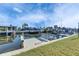 Waterfront property featuring a private dock and boat slip on a sunny day at 1025 Apollo Beach Blvd # 1, Apollo Beach, FL 33572