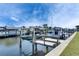 Waterfront property featuring a private dock and boat lift with boats on a canal at 1025 Apollo Beach Blvd # 1, Apollo Beach, FL 33572