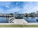Waterfront property featuring a private dock with boat lift and scenic canal views at 1025 Apollo Beach Blvd # 1, Apollo Beach, FL 33572