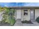 Attractive home exterior featuring dual entrances, fresh landscaping, and modern lighting at 1025 Apollo Beach Blvd # 1, Apollo Beach, FL 33572