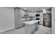 Updated kitchen with a stylish island, new stainless steel appliances, and gray cabinetry at 1025 Apollo Beach Blvd # 1, Apollo Beach, FL 33572