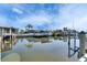 Real estate showcasing a waterfront view of a backyard boat dock and canal at 1025 Apollo Beach Blvd # 1, Apollo Beach, FL 33572