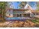Spacious backyard with a refreshing swimming pool and multi-level deck at 1130 Serpentine S Dr, St Petersburg, FL 33705