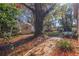 Relax in the backyard with a brick path and access to the pool at 1130 Serpentine S Dr, St Petersburg, FL 33705