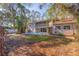 Large backyard with mature trees and a refreshing pool at 1130 Serpentine S Dr, St Petersburg, FL 33705