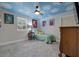 Cozy bedroom with cloud ceiling, a large window and comfy decor at 1130 Serpentine S Dr, St Petersburg, FL 33705