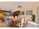 Open dining area featuring a large table and a view to the living area at 1130 Serpentine S Dr, St Petersburg, FL 33705