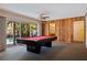 Game room with a pool table and access to the backyard at 1130 Serpentine S Dr, St Petersburg, FL 33705