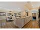 Bright kitchen with granite countertops open to the adjacent dining room at 1130 Serpentine S Dr, St Petersburg, FL 33705
