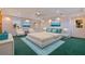 Spacious main bedroom with two windows, ocean artwork and comfortable bed at 1130 Serpentine S Dr, St Petersburg, FL 33705
