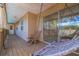 Covered porch with hammock swing and sitting area, accessible through sliding glass doors at 1130 Serpentine S Dr, St Petersburg, FL 33705