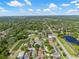 Beautiful aerial view of a residential community, highlighting lush landscaping, community lakes, and well-maintained homes under blue skies at 11611 Jordans Landing Ct, Riverview, FL 33569