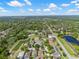 Beautiful aerial view of a residential community, highlighting lush landscaping, community lakes, and well-maintained homes under blue skies at 11611 Jordans Landing Ct, Riverview, FL 33569