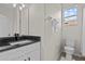 Bright bathroom with a white vanity, granite counter and a toilet at 11611 Jordans Landing Ct, Riverview, FL 33569