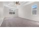Bright, spacious bedroom with tray ceiling and large windows at 11611 Jordans Landing Ct, Riverview, FL 33569